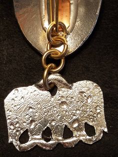 A decrative pewter piece that spreads out Bead strands between 2 brooches . The shape is a S.C.A. Pelican Shape the short Chain is 4 links. Made of 3/32 Yellow Bronze. they are sold by the pair and will show as the Picture does . The Brooches are Sold Seperatly . the castings are thicker on the hole ends to make them more Durable. When you purchase this item you get 2 of the Hangers/ Spreaders . and these ones are Mirrored . Handmade Silver Costume Jewelry Brooches, Collectible Silver Metal Brooches, Unique Metal Jewelry Brooch, Unique Metal Brooch, Unique Silver Metal Brooches, Unique Silver Metal Brooch, Bead Strand, Spreads, Hangers