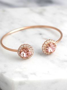 Blush Bracelet, Morganite Bridal Bracelet, Bridal Rose Gold Bracelet, Bangle Gold Bridal Bracelet, Bridesmaids Gifts, Dusty Pink Bracelet  Petite Delights is an Official SWAROVSKI® Branding Partner Official Swarovski Elements® Partner Made with real genuine high quality Austrian Swarovski ©Crystal . Our brand is legally licensed & authorized By Swarovski Company for high quality manufacturing. This pair comes with Swarovski genuine tag , this is unique to our store . They serve as a sign ... Elegant Adjustable Bridesmaid Bracelets, Elegant Bridesmaid Bracelets, Rose Gold Jubilee Cuff Bracelet For Wedding, Delicate Pink Bracelets For Wedding, Rose Gold Jubilee Bracelet For Wedding, Delicate Pink Bracelet For Wedding, Rose Gold Bracelet For Bridesmaid Gift, Elegant Bangle Bracelets For Bridesmaid Gift, Adjustable Rose Gold Bracelets For Wedding