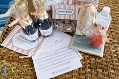 some wine bottles and other items on a wicker table