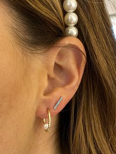 These post hoops are a perfect modern update on the pearl earring! 14k gold hoops featuring 3 small diamonds and a freshwater pearl balance in the center. Luxury Single Hoop Pearl Earring, Pearl Earring, The Pearl, Gold Hoops, Fresh Water, Freshwater Pearls, Ear Cuff, Pearl Earrings, Diamonds