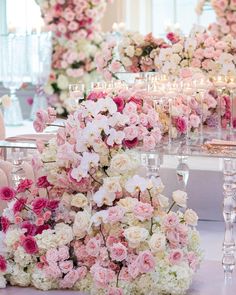 the table is covered with pink and white flowers