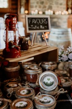 there are many jars that have some food on top of them and the sign says favours take me