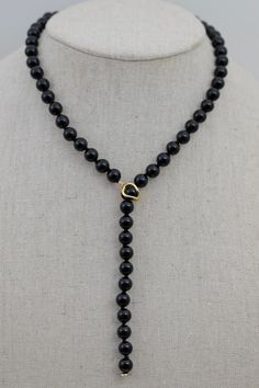 Material               : Black Onyx  Gemstone Beads with 925 Silver / Gold clasp Quantity              :  One Necklace  Length                 :  20 inch approx. Color                     : Black Onyx as pictured Bead Shape         : Round Smooth as pictured Bead Size             : 8mm approx. Lead Time & Shipping :  We ship your order in 3-5 business days (Mon - Fri). If we offer FREE DOMESTIC shipping, package will be shipped via USPS First Class mail on orders shipping within the U.S. W H O L E S A L E    I N Q U I R Y :- Please convo us at anytime if you need to purchase in Wholesale Quantity and Custom Made Orders.  We will be very happy to assist you at our earliest convenience. Convertible Fashion, Y Necklace, Onyx Gemstone, Necklace Length, Lead Time, First Class, Beautiful Hand, Black Onyx, Gemstone Beads