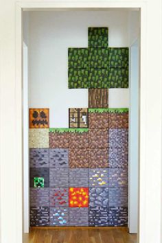 a room that has some pixel art on the wall and wood flooring in front of it