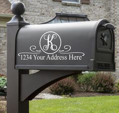 a mailbox that is in front of a brick building with the words, personalized address