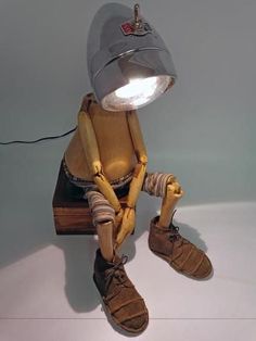 a light that is on top of a wooden table next to a pair of shoes