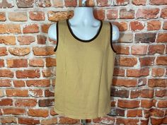 MEASURES -  19" pit to pit and 26" long TAGGED - fits M use measurements Vintage 1970s ribbed tank top. Excellent condition lightly used no major flaws -My policy is NO RETURNS. If I made an error I will make it right 100% but I am not responsible if you change your mind/"item does not fit". PLEASE use the measurements provided if you don't know how ask me I will gladly help you :) - This is a TRUE VINTAGE item! Vintage clothing sizing varies wildly ALWAYS use the measurements and info provided Retro Stretch Tank Top, Retro Fitted Cotton Tank Top, Retro Tank Vest Top, Retro Tank Top Vest, Vintage Fitted Tank Vest, Vintage Fitted Tank Top, Fitted Retro Cotton Tank Top, Retro Brown Sleeveless Top, Fitted Vintage Tank Top