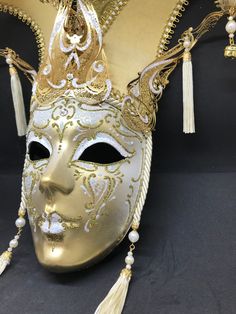 Venetian Mask for decoration - Traditional and original papier-mache Venetian mask, handmade and decorated with metal insert, gold-leaf and glitters,enriched with Swarovski crystals. dimensions::Hight 43cm,width 27cm Decorations only,Not wereable All our masks are handmade papier-machè masks made in Venice. Our decorators use techniques typical of the Venetian tradition such as stucco, acrylics, gold and silver-leaf, macramè, passementerie, glitters and crequelè to offer you a wide range of orig Artistic Full Face Masks For Mardi Gras, Venetian Masks And Prosthetics For Carnival, Venetian Masks For Carnival Themed Events, Gold Full Face Masquerade Mask For Carnival, Gold Full Face Masks For Carnival, Gold Full-face Masks And Prosthetics For Carnival, Gold Full Face Masks And Prosthetics For Carnival, Venetian Masks And Prosthetics For Mardi Gras, Traditional Masks And Prosthetics For Mardi Gras Carnival