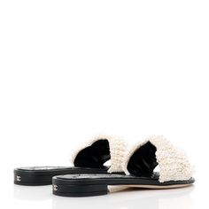 This is an authentic pair of CHANEL Fantasy Calfskin Pearl Cord CC Mules size 38 in Ivory and Black. These sandals are crafted of quilted black calfskin leather and beaded crossover straps. Chanel Shoes, Crossover, Calf Skin, Chanel, Sandals, Leather, Black