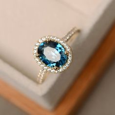 This ring features a 7*9mm oval cut London blue topaz and 14k sold yellow gold. Customization is available. It is made by hand, and it will take about 7 days to finish the ring after your payment is completed. Main stone: London blue topaz Main stone weight: Approx 2.00 ct Metal type: 14k sold yellow gold Accent stone: cz Customization is available, I also can make it with 14k solid gold (white or rose) and diamond accent stone, just feel free to contact me. Any question, just let me know. :) My Topaz Ring Yellow, Yellow Topaz Ring, Dream Rings, Blue Topaz Engagement Ring, Topaz Engagement Ring, London Blue Topaz Ring, Dream Engagement, Dream Engagement Rings, 18k Gold Ring