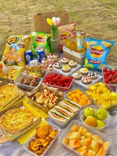 a table topped with lots of different types of food and snacks on top of it