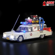 a lego police car with lights on and flashings is shown in the dark background