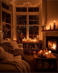 a living room filled with furniture and lit candles