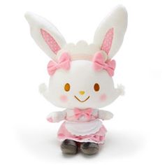 a white stuffed animal with pink ears and a dress on it's head, sitting in front of a white background