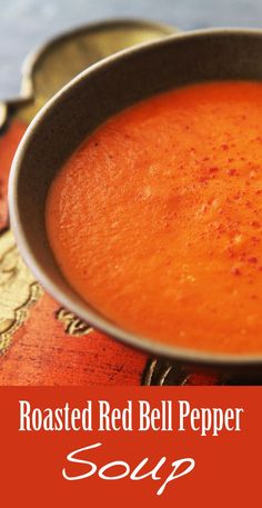 a bowl of roasted red bell pepper soup with the title above it reads, roasted red bell pepper soup