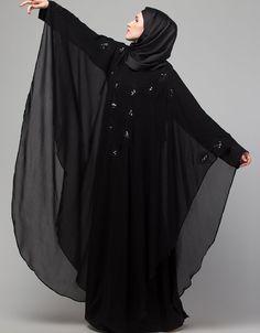 Beautiful Black Color embroidery Abaya easy to wear Back close with loop, button & zip, easy to wear embroidery On Chest Hijab and band shown in the image can be bought separately Fabric: PartyCare: Mild machine wash/ hand Cold Wash/Dry cleanWe request customers to carefully choose the correct size and dress length referring to our size chart Black Long Kaftan With Dabka Work, Black Kaftan With Dabka Work For Eid, Eid Black Kaftan With Dabka Work, Black Dabka Work Kaftan For Eid, Black Long Sleeve Kaftan For Eid, Black Abaya With Dabka Work, Black Abaya With Dabka Work For Eid, Black Long Khimar For Eid, Black Long Sleeve Khimar With Dabka