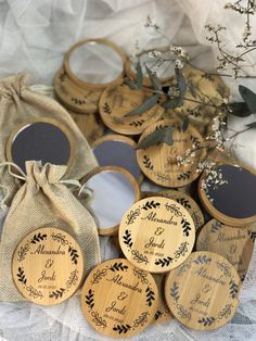 wooden wedding coasters with personalized names and date on them are shown in front of a bag