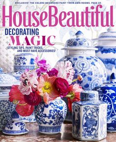 the cover of house beautiful featuring blue and white vases with pink flowers in them