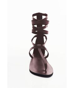 This gladiator sandal designed with eye-catching crisscross straps is sure to make a chic statement with any look you pair it with. Toe style: open toe Back zip closure Leather upper and lining/synthetic sole Imported Women's Shoes SIZE INFO Whole sizes only; for 1/2 sizes, order next size down.