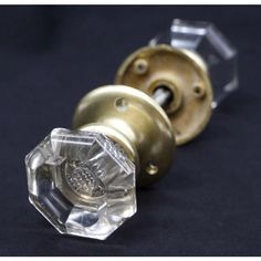 Vintage octagon clear glass door knob set with controlled bubbles and brass rosettes. Good condition with appropriate wear from age. Priced as two door knobs, two rosettes, and a spindle. Priced each. The manufacturer and exact date of creation are unknown. The dimensions are Knob 2.125 in. diameter x 2.25 in. D, rosette 2.25 in. diameter x 0.5 in. D. Glass Door Knob, Glass Door Knobs, Door Knob, Door Knobs, Glass Door, Clear Glass, Bubbles, Brass, Glass