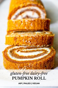 the gluten free dairy - free pumpkin roll is cut into slices and sits on a white plate