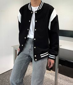 Wear this with an oversized t-shirt and jeans for a comfy look. Perfect for chilly afternoon walks Functional pockets Relaxed fit Black Varsity Jacket Outfit, Sound Of Magic, Black Varsity Jacket, Varsity Jacket Outfit, Black Outerwear, Fashion Chingu, Types Of Coats, Jacket Outfit, T Shirt And Jeans