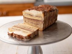 a piece of cake sitting on top of a silver plate