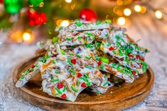 a wooden platter filled with christmas cookies on top of a table