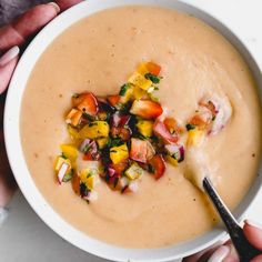 two bowls filled with soup on top of a table