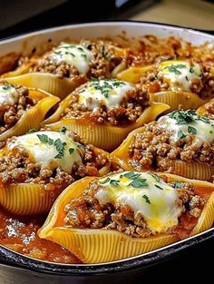 stuffed shells filled with meat and cheese in a casserole dish, ready to be eaten