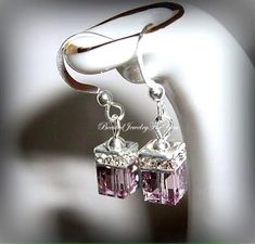 Light Amethyst Austrian crystals measure 6mm that are complimented with a crystal squaredelle to complete this lovely set of earrings. They hang from silver ear wires. You may choose different colors from the drop-down menu. These are perfect to gift to your bridesmaids, best friend, daughter and many more.... Check my shop for matching bracelets!  Click here to return to my shop's homepage: https://www.etsy.com/shop/beadedjewelryforyou?ref=simple-shop-header-name&listing_id=604235185 Mothers Birthstone Bracelet, Drop Earrings Wedding, Beautiful Baubles, Bridal Party Jewelry, Mothers Bracelet, Diamond Life, Wedding Earrings Drop, June Birthstone Jewelry, Bride Earrings