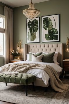 a bedroom with a large bed and two paintings on the wall above it's headboard