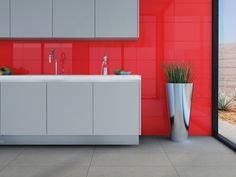 a modern bathroom with red and gray walls