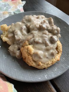 biscuits and gravy on a gray plate