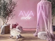 a pink room with a rocking horse in front of it and the word ava on the wall