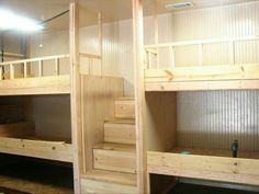 bunk beds with stairs in an empty room