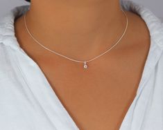 Tiny CZ diamond Choker, Sterling Silver Necklace with Solitaire Cubic Zirconia Diamond, Dainty Layering Choker Dainty and minimalist, this choker necklace is made with a brilliant cut solitaire CZ diamond in the prong setting. Attached on a short sterling silver chain, delicate yet strong, it is perfect for layering or wearing alone. Perfect present for the ones you love if you beat the temptation to live it for your self. ⭐️ Details Sterling Silver chain, delicate yet strong Brilliant cut solit Silver Choker Necklace, Layered Necklaces Silver, Layered Chokers, Diamond Choker, Solitaire Necklaces, Silver Choker, Pretty Jewelry, Silver Spring, Choker Necklaces