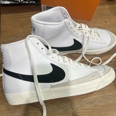 These Nike High-Top Sneakers Feature A Predominantly White Color Scheme With A Large Black Swoosh Logo, Smooth Leather Upper, And Padded Collar Around The Ankle. Shoes Nike White, Black Nike High Tops, Nike High Top, Black High Top Sneakers, Nike High Tops, Hightop Sneakers, White Color Scheme, Black High Tops, Swag Shoes