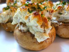 stuffed mushrooms with cheese and herbs on them are ready to be eaten for lunch or dinner