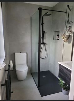 a bathroom with a shower, toilet and sink