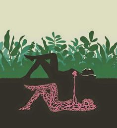 a person laying on the ground in front of some plants with a pink string attached to it