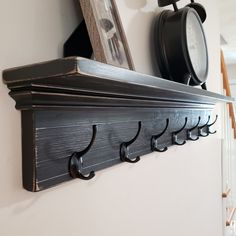 there is a shelf with hooks on it