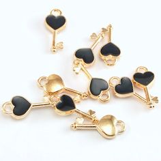 Pretty key shaped jewelry charms with rose toned KC gold alloy and black enamel on one side. Use for jewelry making and crafting projects. Perfect for  bracelet, necklace, earrings, keychain, zipper pulls and other projects.     Made out of Alloy  and enamel     Rosy KC Gold, black colour     Dimensions      About 16x7mm Quantity      10 or 20 pieces, choose from dropdown If you need help, please send us a message to assist in any way! Follow us on Facebook for product updates and more great pro Key Heart, Charms Bracelet, Jewelry Charms, Gold Alloys, Wine Charms, Jewelry Pendant, Gold Enamel, Zipper Pulls, Black Colour