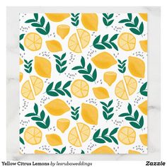 yellow lemons and green leaves on white paper