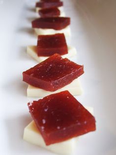 small pieces of fruit sitting on top of a white plate