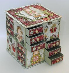 a decorative box with pictures on it sitting on a table