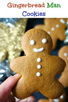 a gingerbread man cookie is being held up