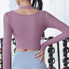 Relay Top. A comfortable fit with a unique look for workouts, yoga or just hanging out. Pair with an item from our leggings collection. Detail: Buckle at Bust/ThumbholesSleeve Style: LongMaterial: Polyester, Spandex Stretch Activewear For Yoga With Thumbholes, Purple Moisture-wicking Tops For Yoga, Purple Moisture-wicking Yoga Tops, Yoga Activewear With Thumbholes, Breathable Tops For Pilates, Purple Athleisure Tops For Pilates, Purple Long Sleeve Yoga Top, Moisture-wicking Purple Tops For Pilates, Purple Long Sleeve Activewear For Yoga