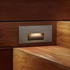 a wooden wall with a light in the middle