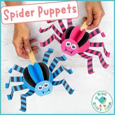 two paper spider puppets are being held by someone's hands, with the words spider puppets above them